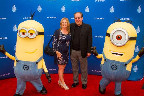 Attendees and minion characters in front of LA Biomed backdrop at Spirit of Innovation Gala 2018