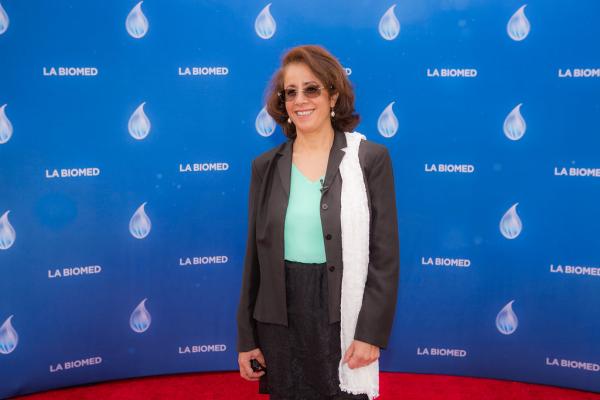 Attendee in front of LA Biomed backdrop at Spirit of Innovation Gala 2018