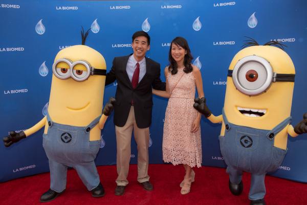 Attendees and minion characters in front of LA Biomed backdrop at Spirit of Innovation Gala 2018