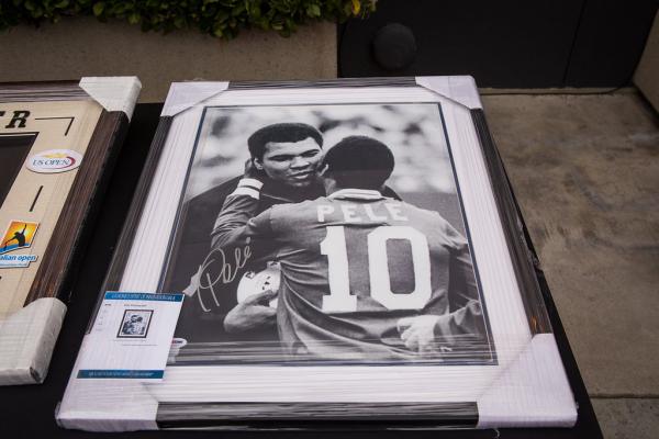 Framed picture of Pele and Mohammad Ali